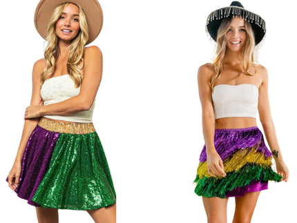 Two women wearing stylish Mardi Gras skirts, one in a sequin skater mini skirt and the other in a tiered tinsel fringe skirt, both in purple, gold, and green for a festive look.